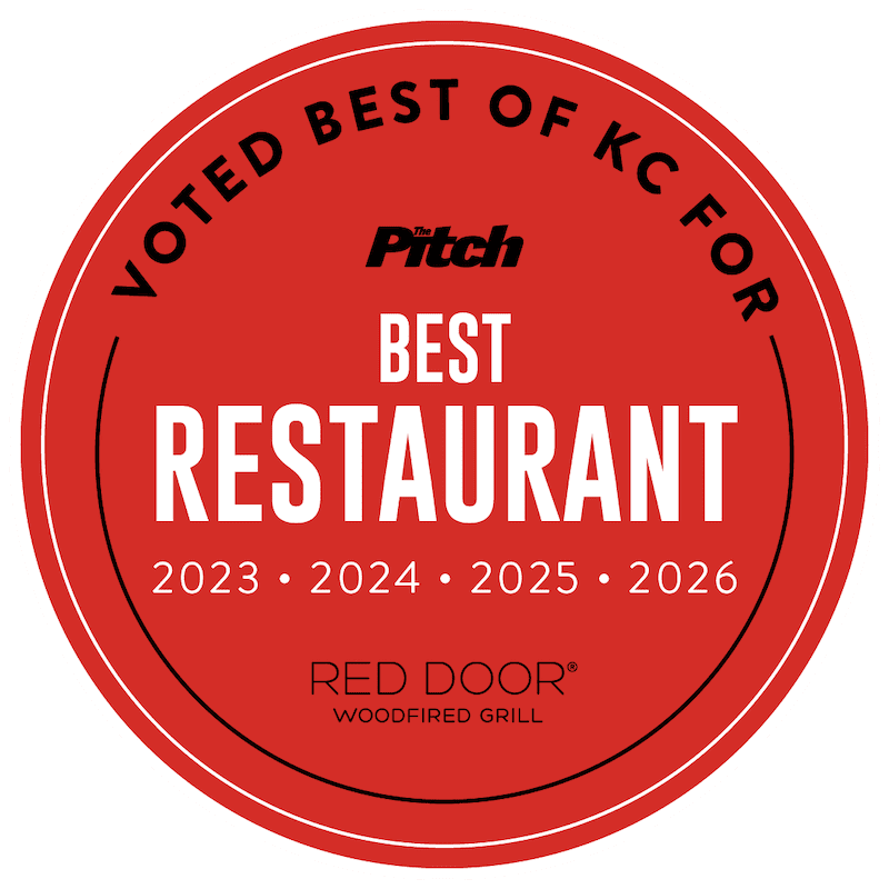 Red circular award badge reading 'Best Restaurant' with years 2023–2026 and 'Red Door Woodfired Grill' logo in the center.